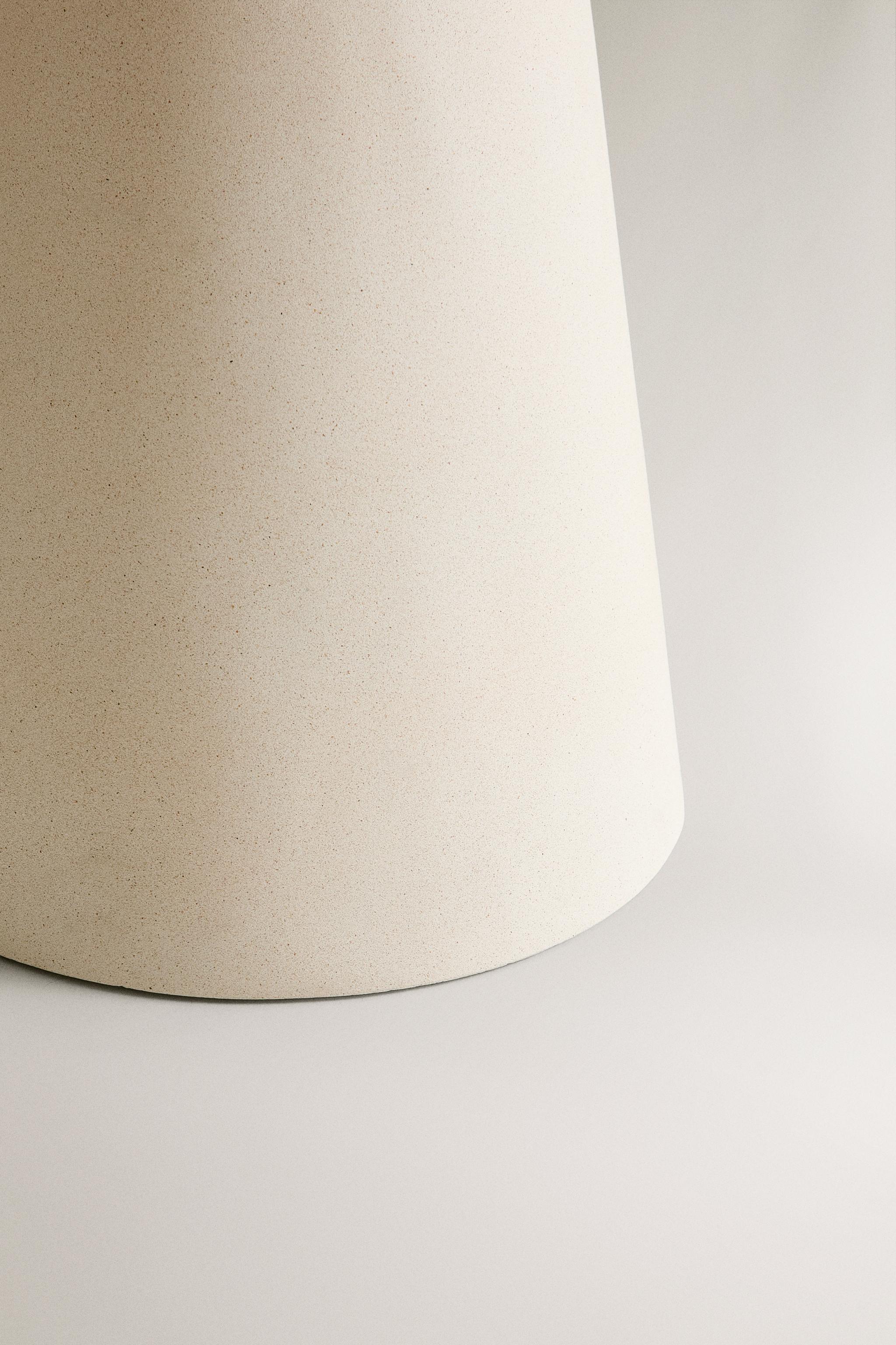 TABLE WITH A CONICAL BASE